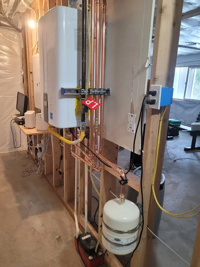 Licensed plumber repairing a kitchen sink in Wilmington